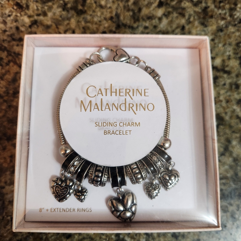 Catherine Malandrino Silver Bracelet with Intricate Charms